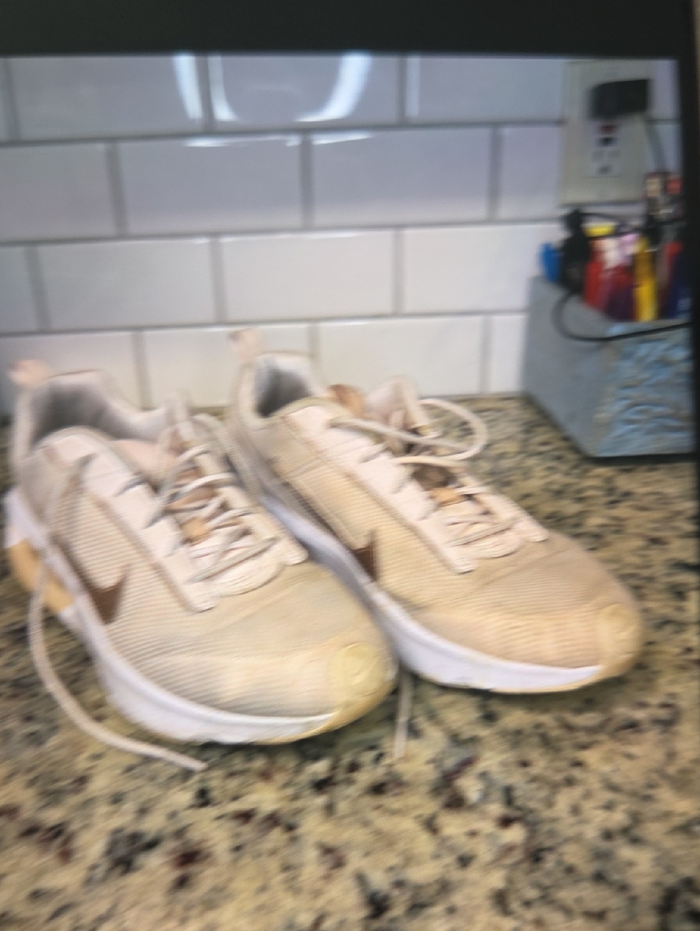 Light Beige Nike Athletic Sneakers with Brown Swoosh
